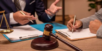 Close-up of lawyer and client discussing.